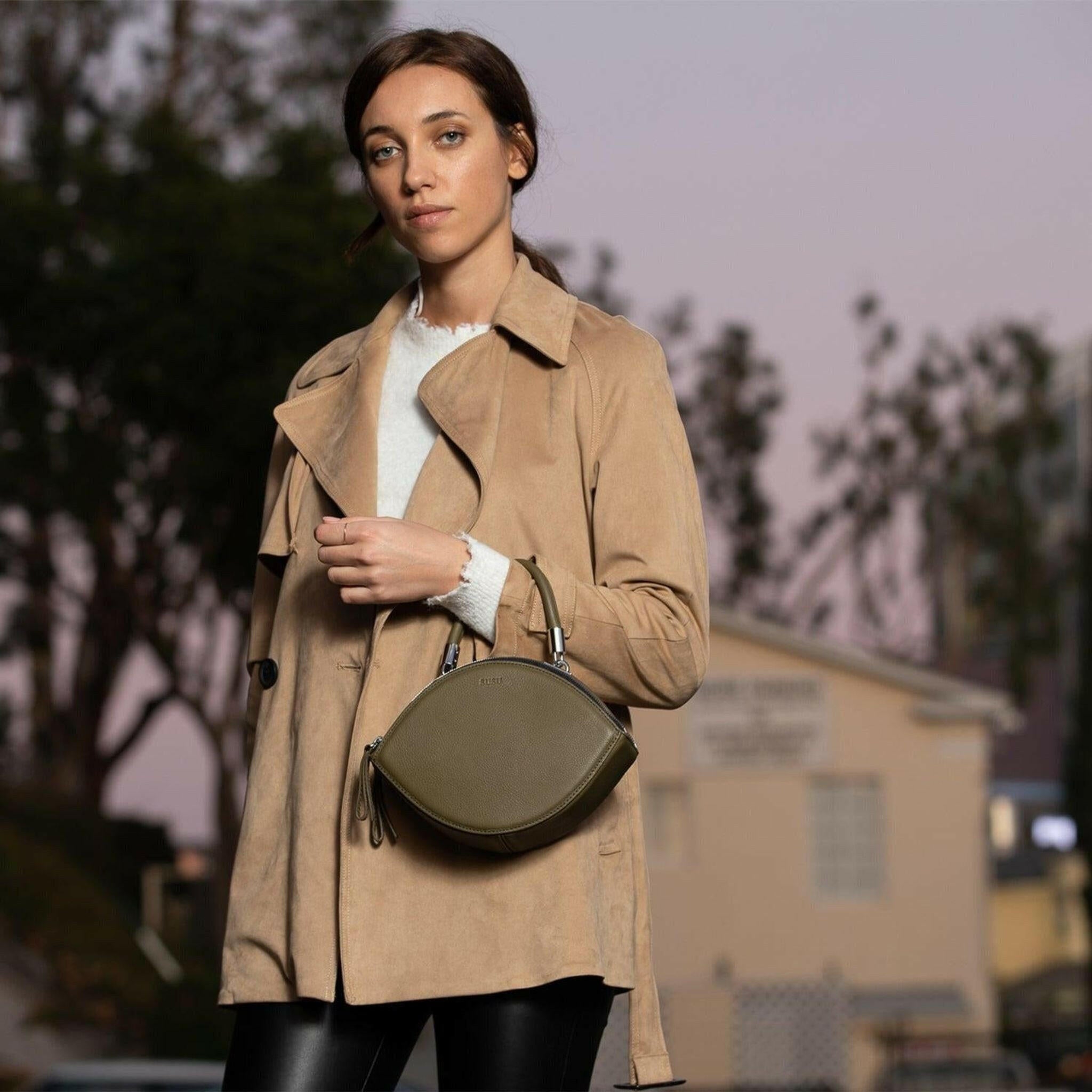 Kiss Circle Shape Leather Crossbody Bag in Olive Green.