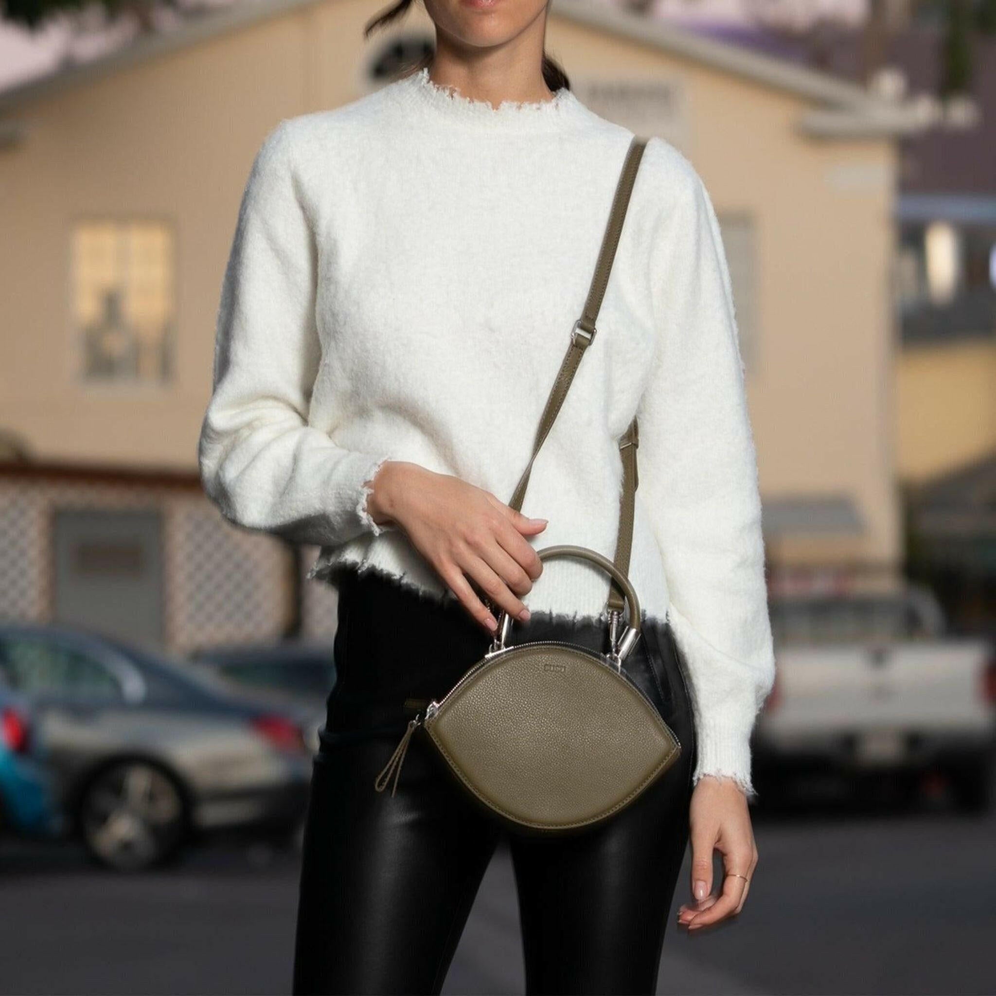 Kiss Circle Shape Leather Crossbody Bag in Olive Green.