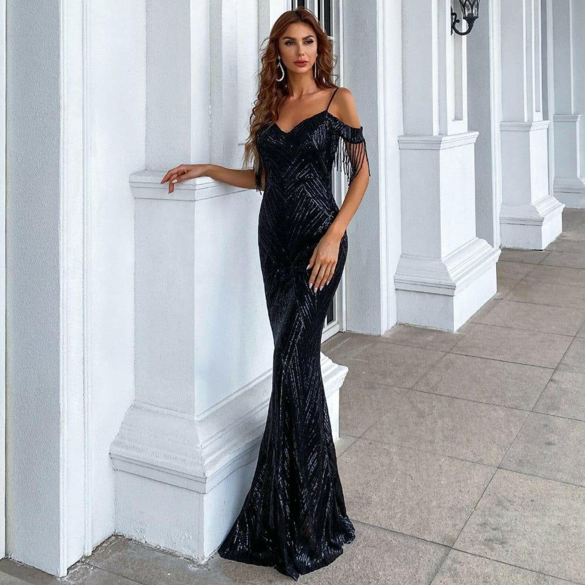 Farah Off Shoulder Fringe Tassel Gown in Black.