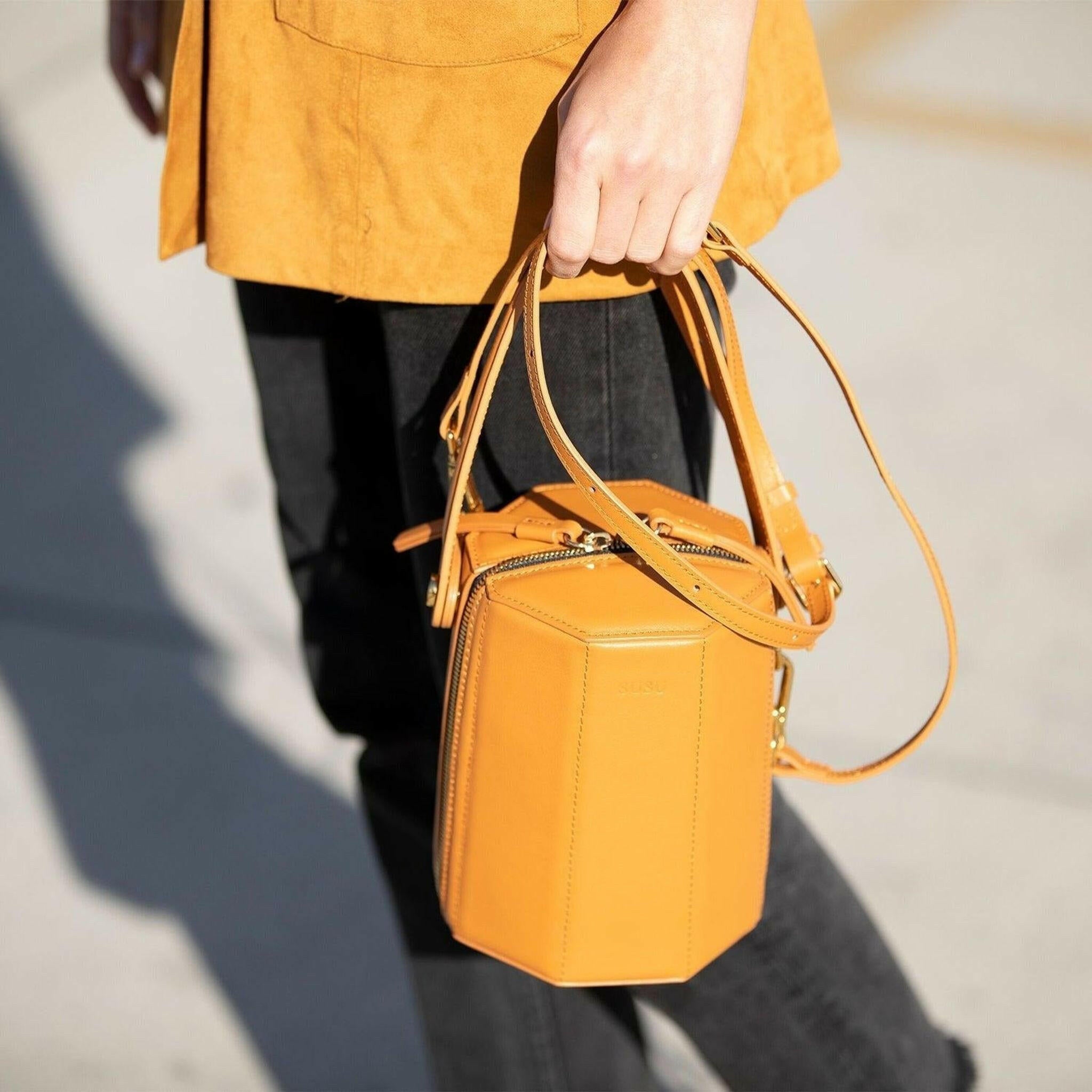 Harper Leather Bucket Bag in Orange.